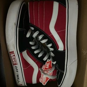 Black and dark red vans hightops .